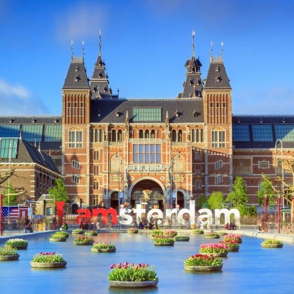 Amsterdam, The Netherlands - May 2, 2014: Beautiful vibrant of tulips in the pond in front of the Rijksmuseum (National state museum) in Amsterdam in spring on May 2, 2014